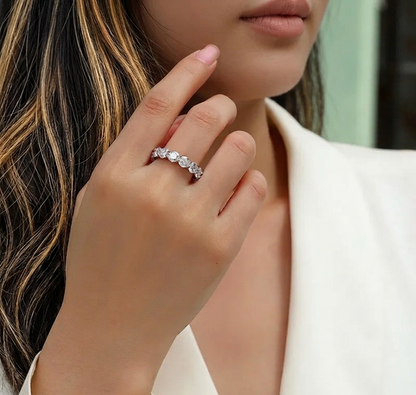 The Cleo Shared-Prong Moissanite Eternity Band